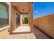 A covered patio offers a peaceful outdoor space with desert landscaping and a blue sky at 2565 S Signal Butte Rd # 8, Mesa, AZ 85209