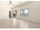 Large bedroom featuring tile floors, a sliding glass door to the patio, and a window at 2565 S Signal Butte Rd # 8, Mesa, AZ 85209