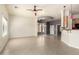 Spacious living room featuring tile floors, pendant lighting, and a tray ceiling detail at 2565 S Signal Butte Rd # 8, Mesa, AZ 85209