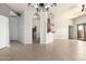 Open living room showcasing tile flooring and an elegant chandelier lighting the space at 2565 S Signal Butte Rd # 8, Mesa, AZ 85209