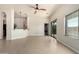 Spacious living room featuring tile floors, a ceiling fan, and a sliding glass door at 2565 S Signal Butte Rd # 8, Mesa, AZ 85209