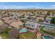 Stunning aerial view showcasing a sparkling pool, sport court, and beautifully landscaped backyard at 2688 S Racine Ct, Gilbert, AZ 85295