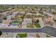 Wide aerial shot of a neighborhood, highlighting the home's location and its proximity to community amenities at 2688 S Racine Ct, Gilbert, AZ 85295