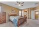 Bedroom featuring a wooden bed frame, a chest of drawers, and carpet flooring at 2688 S Racine Ct, Gilbert, AZ 85295