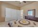 Neutral bedroom with a quilt, closet and ceiling fan providing a calming and restful ambiance at 2688 S Racine Ct, Gilbert, AZ 85295