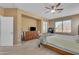 Comfortable bedroom features neutral walls, carpet floors, ceiling fan and a nice view from the window at 2688 S Racine Ct, Gilbert, AZ 85295