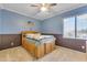 Bedroom featuring two-tone walls, and a platform bed with built-in storage, creating a cozy atmosphere at 2688 S Racine Ct, Gilbert, AZ 85295