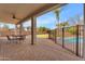 Inviting covered patio with pavers, ceiling fan, outdoor seating, and view of the pool at 2688 S Racine Ct, Gilbert, AZ 85295