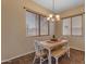 Cozy dining area with natural lighting and a light wood table and chairs at 2688 S Racine Ct, Gilbert, AZ 85295