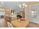 View of the dining room leading into the kitchen and living room at 2688 S Racine Ct, Gilbert, AZ 85295