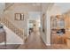 Inviting foyer with a staircase, tile flooring, and views into adjacent living spaces at 2688 S Racine Ct, Gilbert, AZ 85295