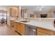 Kitchen view featuring stainless appliances, white countertops and open layout to the living area at 2688 S Racine Ct, Gilbert, AZ 85295