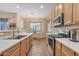 Kitchen with stainless steel appliances, ample counter space, and an open layout to the dining area at 2688 S Racine Ct, Gilbert, AZ 85295