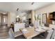 Open dining area flows into the modern kitchen, featuring a spacious layout and lots of light at 28516 N 128Th Dr, Peoria, AZ 85383