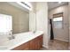 Bathroom with a double sink vanity with white countertops and a shower/tub combination at 3223 W Rapalo Rd, Phoenix, AZ 85086