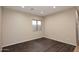 Well-lit bedroom with hardwood floors and neutral tones at 3223 W Rapalo Rd, Phoenix, AZ 85086