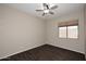 Cozy bedroom with a ceiling fan and hardwood floors at 3223 W Rapalo Rd, Phoenix, AZ 85086