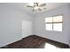 Bright bedroom with closet and a large window at 3223 W Rapalo Rd, Phoenix, AZ 85086