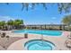 Inviting community pool and hot tub surrounded by lounge seating, perfect for relaxation and socializing at 3223 W Rapalo Rd, Phoenix, AZ 85086