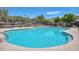 Sparkling community pool with lounge chairs offers a resort-style relaxation experience for residents at 3223 W Rapalo Rd, Phoenix, AZ 85086