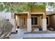 Covered front porch with decorative columns and neutral color palette at 3223 W Rapalo Rd, Phoenix, AZ 85086