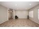 Open-plan living room with tile flooring and plenty of natural light at 3223 W Rapalo Rd, Phoenix, AZ 85086