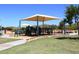 A shaded playground offers recreational opportunities for children within the community park at 3223 W Rapalo Rd, Phoenix, AZ 85086