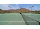 Well maintained tennis court with mountain views, providing a scenic and active lifestyle at 3223 W Rapalo Rd, Phoenix, AZ 85086