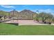 Scenic community sand volleyball court with mountain views and lush green space at 3223 W Rapalo Rd, Phoenix, AZ 85086