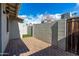 Cozy brick patio area surrounded by a brick wall and wood fence, offering privacy at 3402 N 32Nd St # 116, Phoenix, AZ 85018