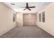 Large bedroom with carpet flooring, recessed lighting, natural light and built-in shelving at 4061 N Point Ridge Rd, Buckeye, AZ 85396