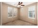 Bedroom with carpeted floor and multiple windows allowing natural light to fill the room at 4061 N Point Ridge Rd, Buckeye, AZ 85396