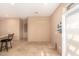 Bright dining area with neutral walls and tile flooring leading to an open floor plan at 4061 N Point Ridge Rd, Buckeye, AZ 85396