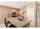 Kitchen featuring granite countertops, a kitchen island, and stainless steel appliances at 4061 N Point Ridge Rd, Buckeye, AZ 85396