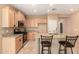 Kitchen with stainless steel appliances, granite countertops, kitchen island and light wood cabinets at 4061 N Point Ridge Rd, Buckeye, AZ 85396