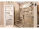 Tiled shower featuring a built-in seat and showerhead; closet can be seen through doorway at 4061 N Point Ridge Rd, Buckeye, AZ 85396