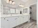 Bathroom featuring a double sink vanity and a spacious mirror at 4170 N 154Th Dr, Goodyear, AZ 85395