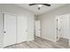 Bedroom with wood-look floors, standard closet, and a neutral color scheme, perfect for relaxation at 4170 N 154Th Dr, Goodyear, AZ 85395