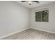 A bedroom featuring a ceiling fan, neutral walls, and a window offering natural light at 4170 N 154Th Dr, Goodyear, AZ 85395