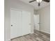 Bedroom with wood-look floors, standard closet, and a neutral color scheme, perfect for relaxation at 4170 N 154Th Dr, Goodyear, AZ 85395