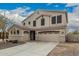 Beautiful two-story home featuring a three-car garage and tiled roof at 4170 N 154Th Dr, Goodyear, AZ 85395