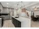 Modern kitchen featuring a large center island and stainless steel appliances at 4170 N 154Th Dr, Goodyear, AZ 85395