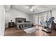 Spacious bedroom featuring a plush bed, french doors leading to a patio, and modern furnishings at 4440 W Fallen Leaf Ln, Glendale, AZ 85310