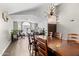 Bright dining room with wood floors, vaulted ceiling, and a large chandelier at 4440 W Fallen Leaf Ln, Glendale, AZ 85310