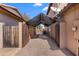 Shaded driveway and gated parking area, providing privacy and protection for vehicles at 4440 W Fallen Leaf Ln, Glendale, AZ 85310