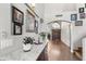 Inviting entryway featuring granite-topped console, decor, and an arched doorway at 4440 W Fallen Leaf Ln, Glendale, AZ 85310