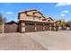 Exterior shot showcasing a house with a three-car garage and a well-maintained yard at 4440 W Fallen Leaf Ln, Glendale, AZ 85310