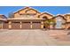 Charming two-story home featuring a three-car garage and desert landscaping at 4440 W Fallen Leaf Ln, Glendale, AZ 85310