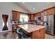 Modern kitchen features granite countertops, stainless steel appliances, and a large island at 4440 W Fallen Leaf Ln, Glendale, AZ 85310