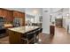 Well-designed kitchen with granite counters, island seating, and stainless steel appliances at 4440 W Fallen Leaf Ln, Glendale, AZ 85310